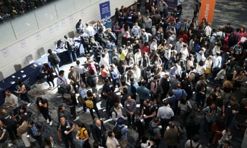 An aerial view of a crowded conference hall