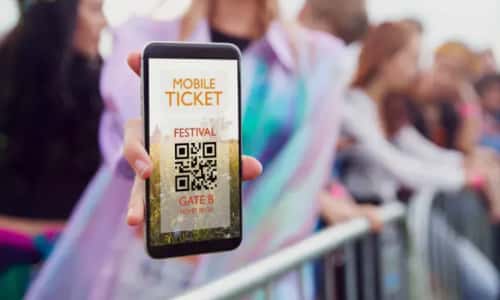A phone showing a mobile festival ticket with a QR code
